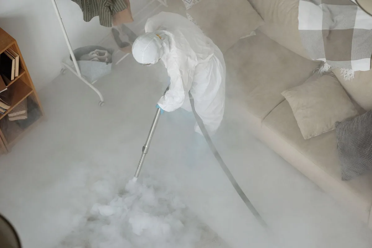 Biohazard cleanup technician in protective equipment, Rock Creek, MN